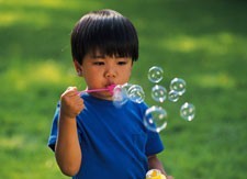 Boy blowing bubbles